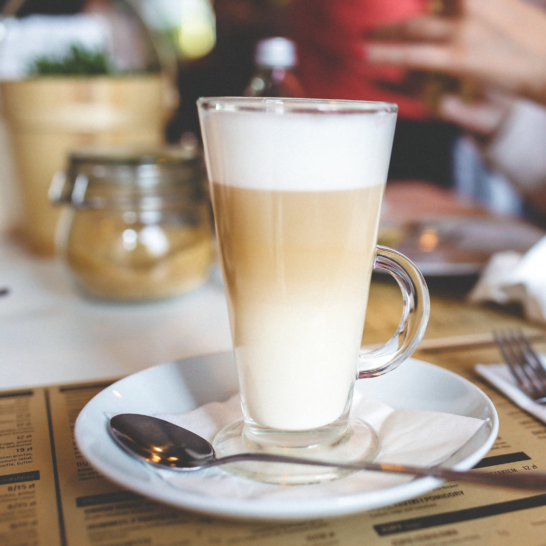 A glass of latte coffee